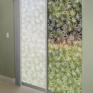 Sliding glass doors with Cannabis Leaf window decor