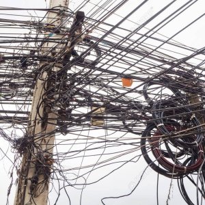 65290422-chaos-of-cables-and-wires-on-electric-pole-in-chiang-mai-thailand-.jpg