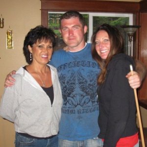 Rhonda Harvey, pictured left, with Rolland Gregg and his wife Michelle.