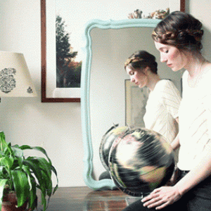 Animated-gif-of-woman-spinning-an-Earth-globe