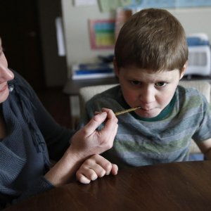 boy taking cannabis oil