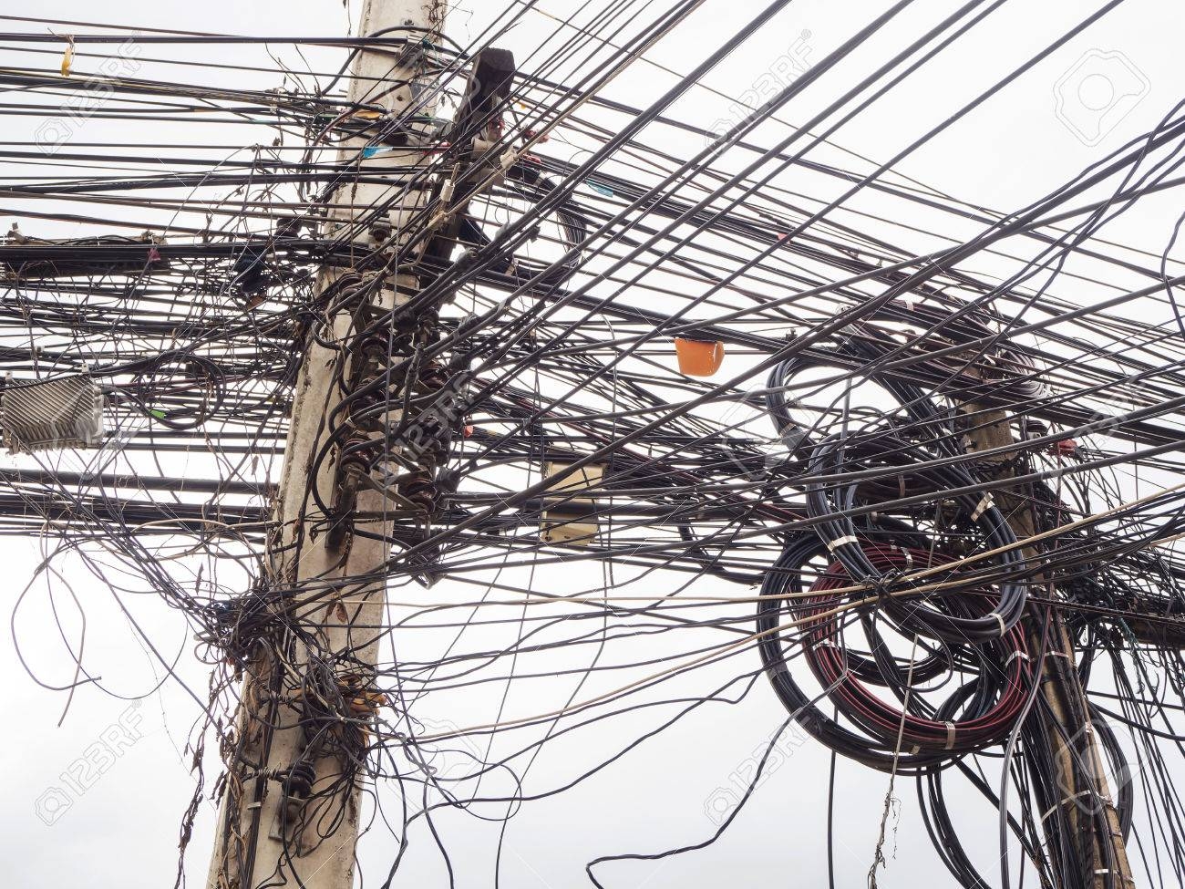 65290422-chaos-of-cables-and-wires-on-electric-pole-in-chiang-mai-thailand-.jpg