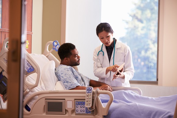 Doctor and Patient in Hospital - Getty Images