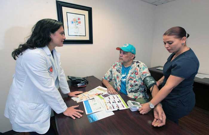 Doctor Michelle Weiner with Patient - Roberto Koltun