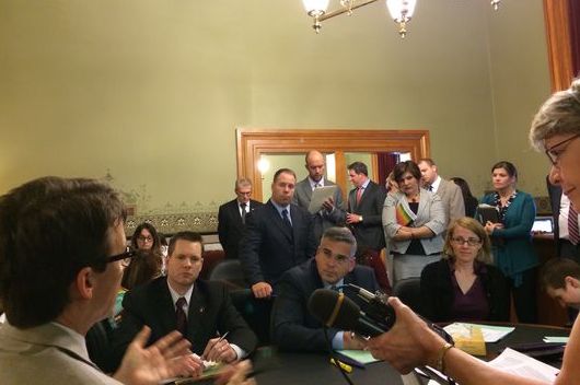 Iowa state Sens. Joe Bolkcom (in profile), Charles Schneider and Matt McCoy