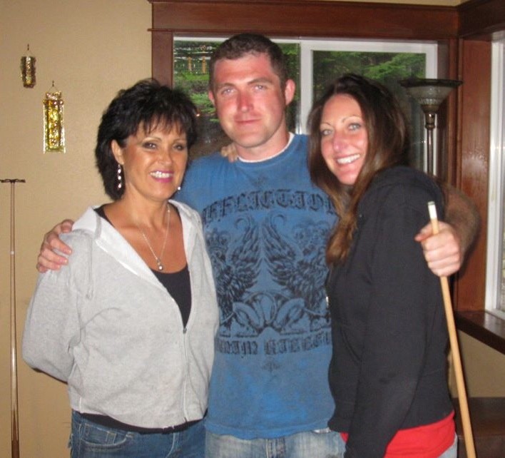 Rhonda Harvey, pictured left, with Rolland Gregg and his wife Michelle.