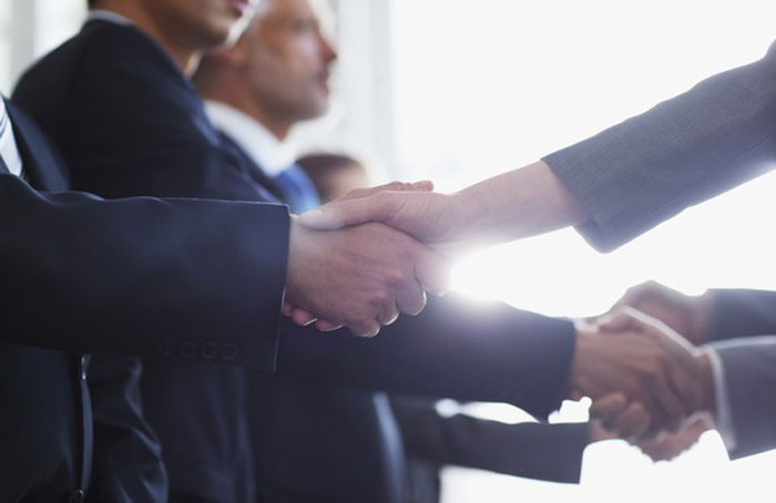 Shaking Hands - Getty Images