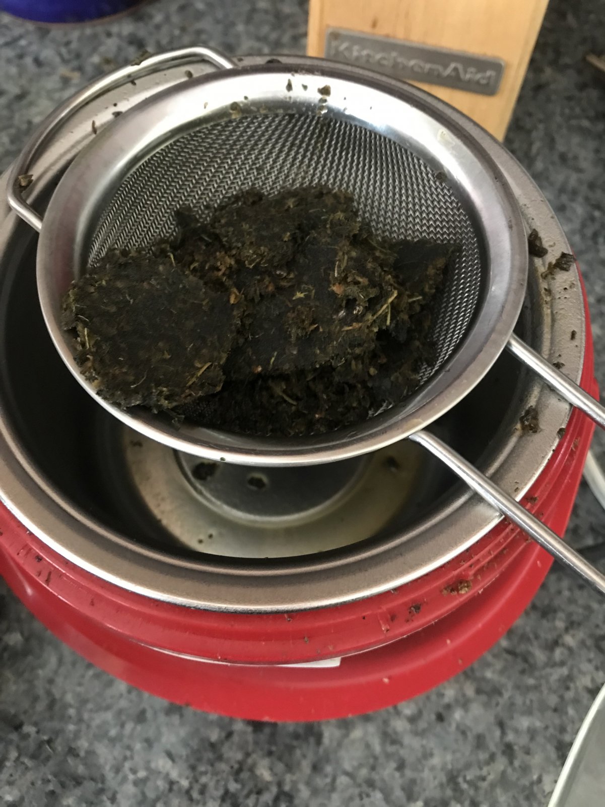 Straining Oil with Mesh Strainer.jpg