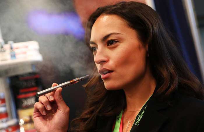 Woman Vaping - Getty