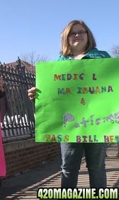 Girl-with-medical-marijuana-sign1.jpg